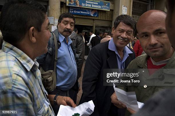 Men discuss the sale of raw emeralds at a retail shop on August 26, 2009 in Bogota, Cundinamarca, Colombia. Colombia produces 55% of the world's...