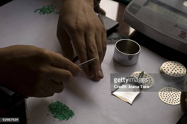 Investors and cut owner weigh emeralds and establish their sale price on August 4, 2009 in Bogota, Cundinamarca, Colombia.Colombia produces 55% of...