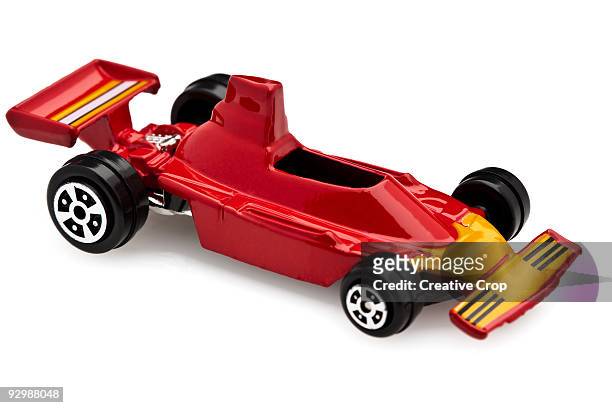 child's red toy race car - toy car white background stock pictures, royalty-free photos & images