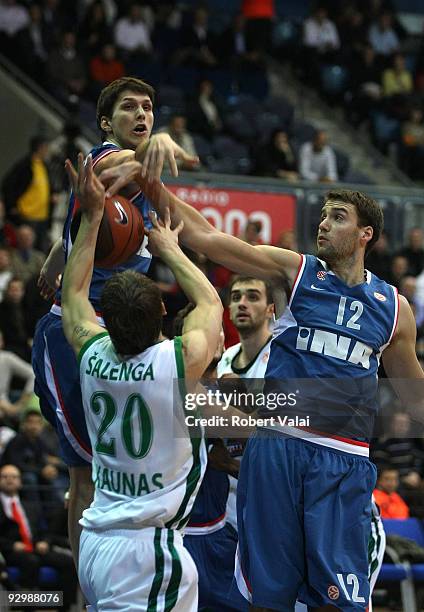 Marko Tomas and Luksa Andric, #12 of Cibona competes with Dainius Salenga, #20 of Zalgiris in action during the Euroleague Basketball Regular Season...