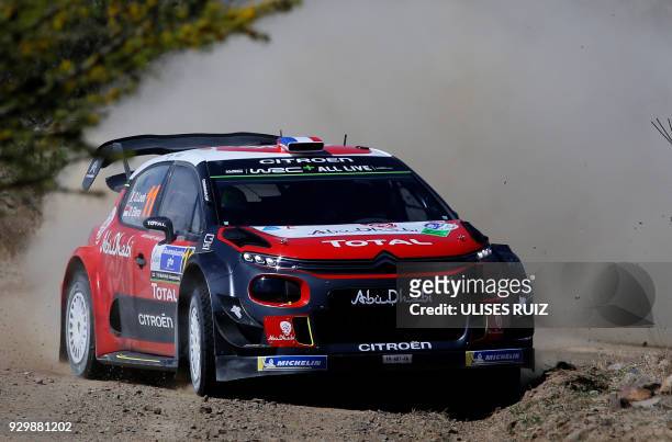 French driver Sebastien Loeb steers his Citroen C3 with co-driver Daniel Elena of Monaco, during the first day of the 2018 FIA World Rally...
