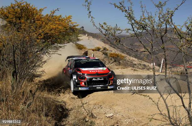 French driver Sebastien Loeb steers his Citroen C3 with co-driver Daniel Elena of Monaco, during the first day of the 2018 FIA World Rally...