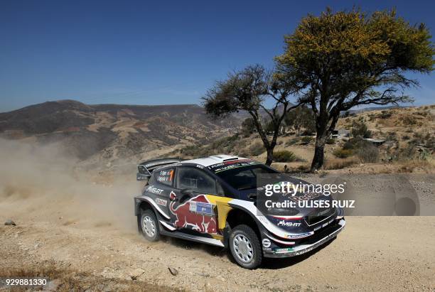 French driver Sebastien Ogier steers his Ford Fiesta WRC with compatriot co-driver Julien Ingrassia, during the first day of the 2018 FIA World Rally...