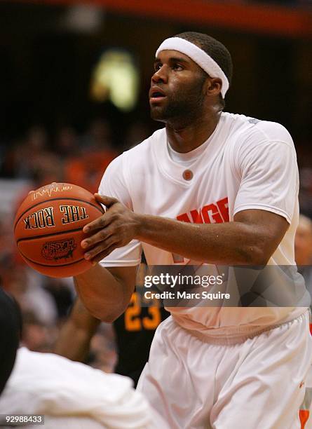 Arinze Onuaku of the Syracuse Orange shoots a foul shot during the game against the Albany Great Danes on November 9, 209 at the Carrier Dome in...