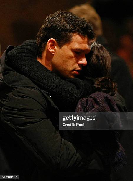 Michael Ballack embraces Teresa Enke during the mourning service for Robert Enke at the Marktkirche on November 11, 2009 in Hanover, Germany. Enke...