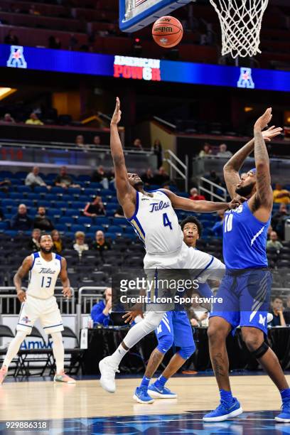 Tulsa guard Sterling Taplin shoots an off balance shot over Memphis forward Mike Parks Jr. During the second half of the AAC Men's Basketball...