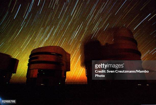 Two of the four telescopes of the Very Large Telescope work under the starry sky of the Atacama desert on October 26 in Paranal, Chile. The VLT...