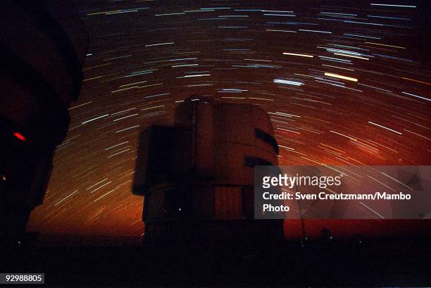Two of the four telescopes of the Very Large Telescope work under the starry sky of the Atacama desert on October 26 in Paranal, Chile. The VLT...