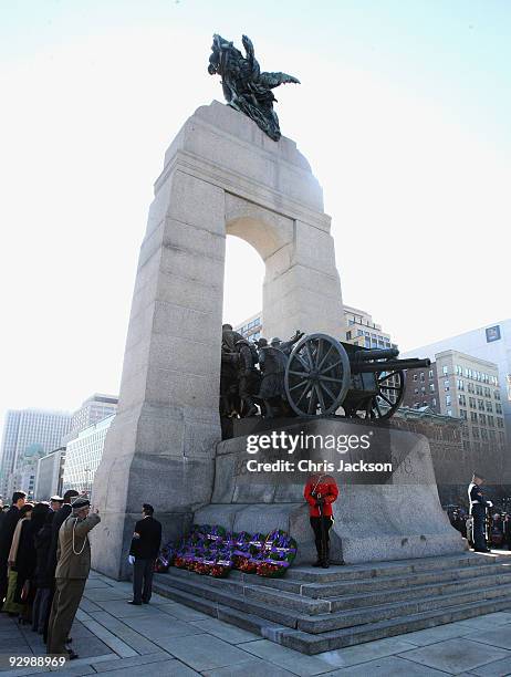 Soldiers stand on the National War Memorial during a Remembrance Day Service on November 11, 2009 in Ottawa, Canada. The Royal couple are visiting...