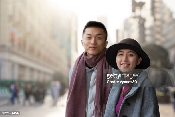 young couples in shanghai nanjing road pedestrian street,china - east asia. - china east asia stock-fotos und bilder