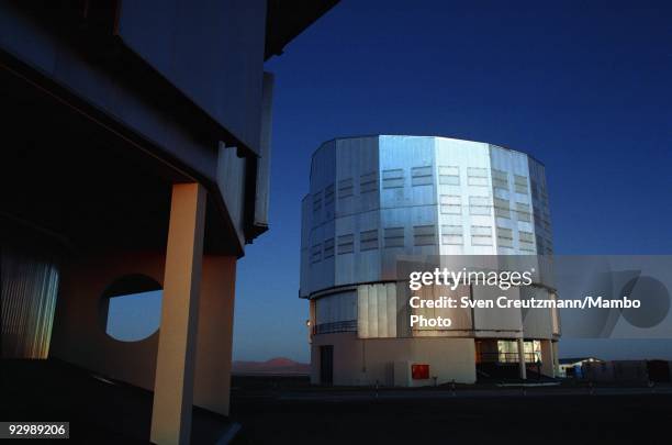 Two of the four telescopes of the Very Large Telescope after sunset over the Atacama desert on October 26 in Paranal, Chile. The VLT Observatory...