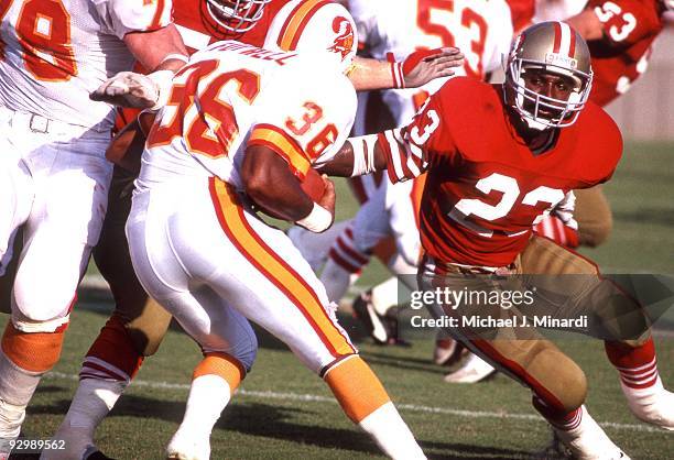 Running Back Spencer Tillman of the San Francisco 49ers blocks the running gain of Corner Back Bobby Futrell of the Tampa Bay Buccaneers on September...