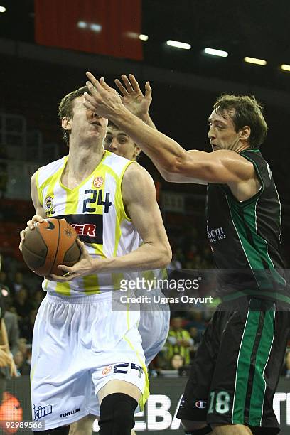 Omer Asik, #24 of Fenerbahce Ulker competes with and Denis Marconato, #18 of Montepaschi Siena competes with in action during the Euroleague...