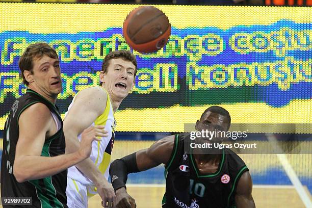 Omer Asik, #24 of Fenerbahce Ulker competes with and Romain Sato, #10 of Montepaschi Siena competes with and Denis Marconato, #18 of Montepaschi...