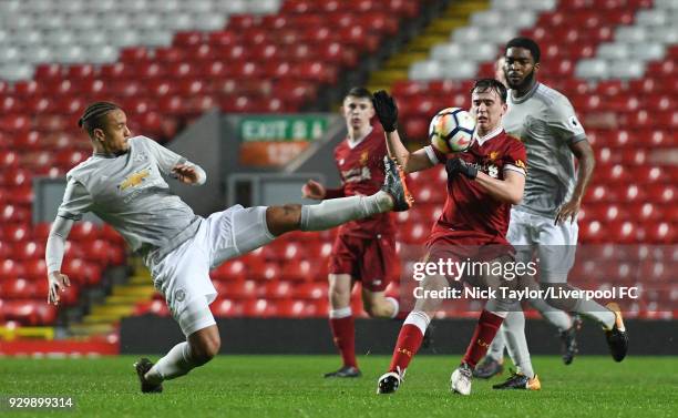 Liam Millar of Liverpool and Cameron Borthwick-Jackson of Manchester United in action during the Premier League 2 match between Liverpool and...
