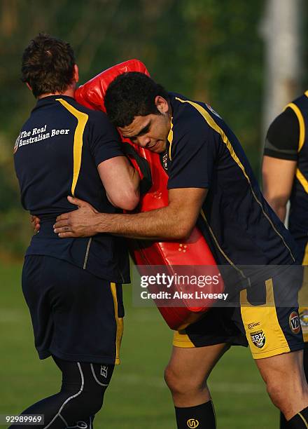 Greg Inglis of the VB Kangaroos Australian Rugby League team hits a tackle bag during the VB Kangaroos training session held at Leeds Academy on...