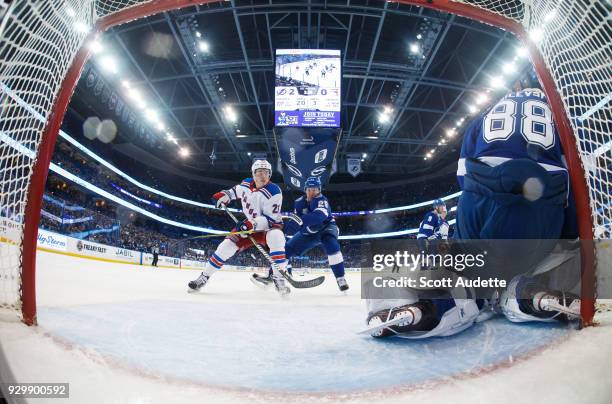 Slater Koekkoek of the Tampa Bay Lightning skates against Jimmy Vesey of the New York Rangers during the first period at Amalie Arena on March 8,...