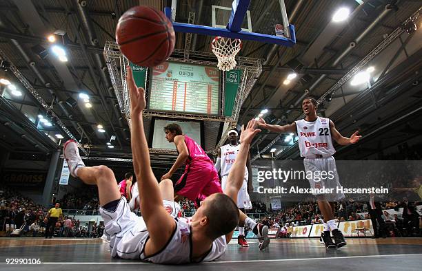 Casey Jacobsen of Bamberg battles for the ball with Artur Kolodziejski of Bonn during the Basketball Bundesliga match between Brose Baskets Bamberg...