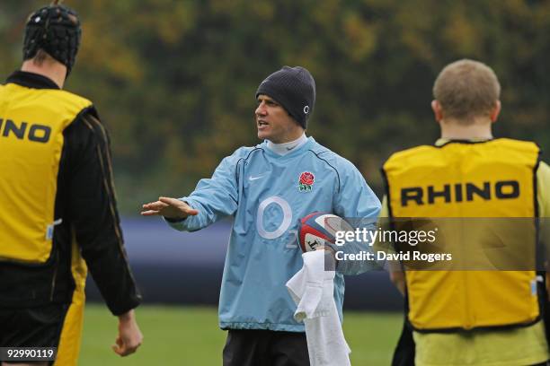 England assistant coach Brian Smith speaks with players during the England training session at Pennyhill Park on November 11, 2009 in Bagshot,...