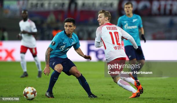 Emil Forsberg of RB Leipzig and Matias Kranevitter of FC Zenit Saint Petersburg compete during the UEFA Europa League Round of 16 match between RB...