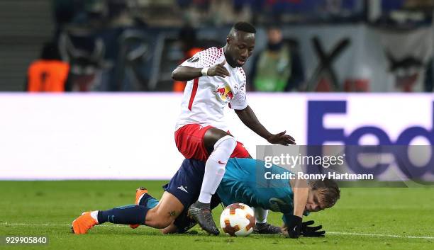 Naby Keita of RB Leipzig and Aleksandr Kokorin of FC Zenit Saint Petersburg compete during the UEFA Europa League Round of 16 match between RB...