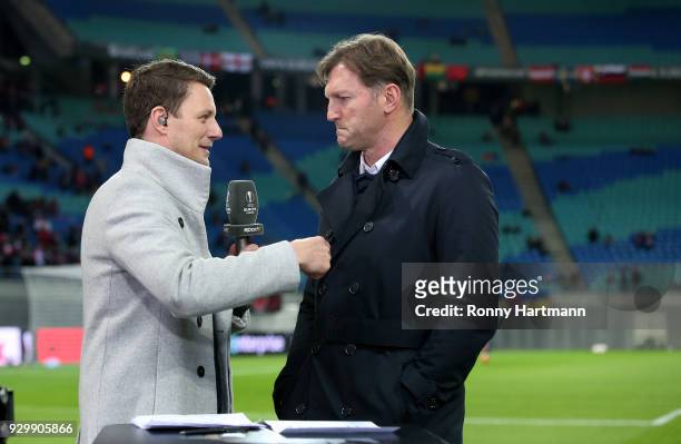 Head coach Ralph Hasenhuettl of RB Leipzig is interviewed by TV Presenter Jochen Stutzky prior to the UEFA Europa League Round of 16 match between RB...