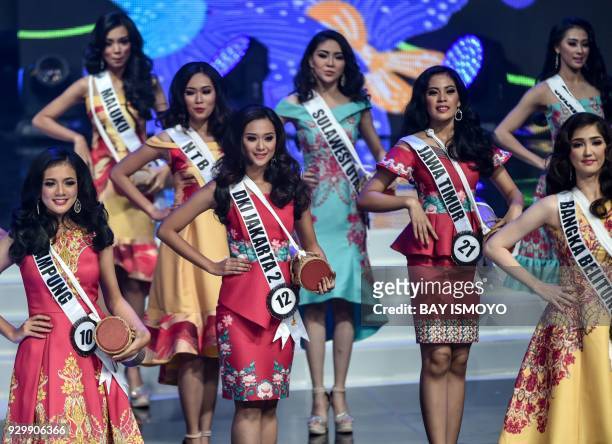 This picture taken on March 9, 2018 shows contestants taking part in the finals of the 2018 Miss Indonesia beauty pageant in Jakarta. / AFP PHOTO /...