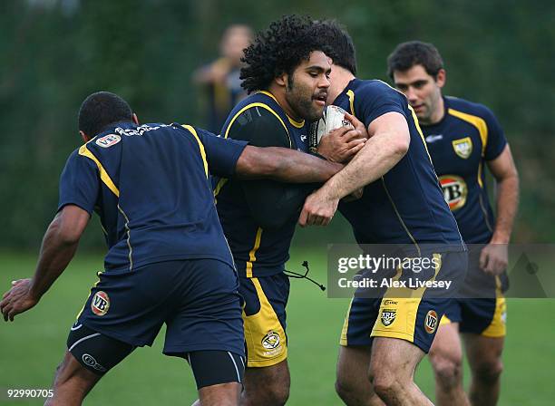 Sam Thaiday of the VB Kangaroos Australian Rugby League team is tackled during the VB Kangaroos training session held at Leeds Academy on November...