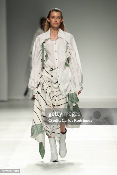 Model walks the catwalk during the Federico Protto show for the Sangue Novo show at the 50th edition of Lisboa Fashion Week 'ModaLisboa' AW 2018 at...