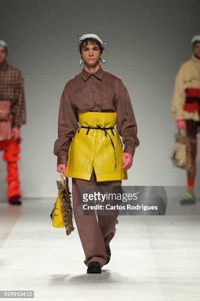 Model walks the catwalk during the Filipe Augusto show for the Sangue Novo show at the 50th edition of Lisboa Fashion Week 'ModaLisboa' AW 2018 at...