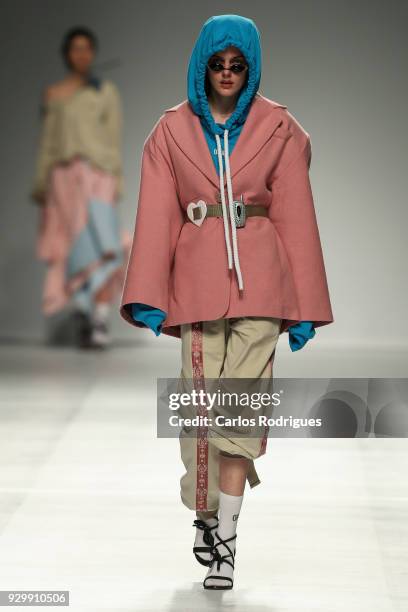 Model walks the catwalk during the Opiar show for the Sangue Novo show at the 50th edition of Lisboa Fashion Week 'ModaLisboa' AW 2018 at Pavilhao...