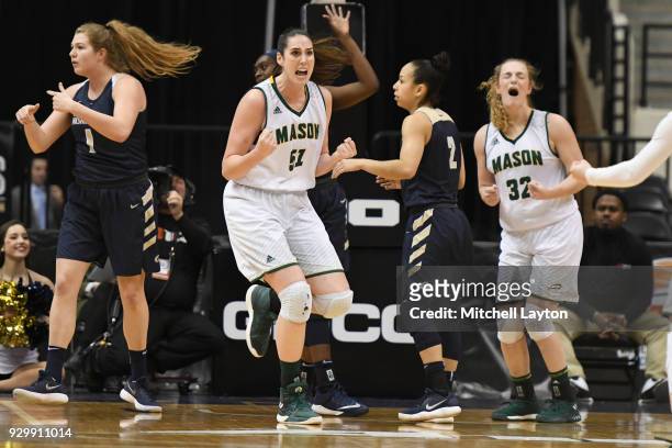 Natalie Butler of the George Mason Patriots celebrates a shot during the quarterfinal round of the Atlantic-10 Women's Basketball Tournament against...