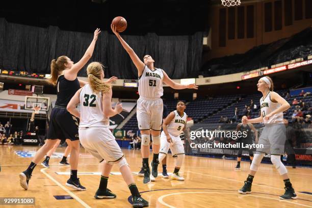 Natalie Butler of the George Mason Patriots pulls down a rebound during the quarterfinal round of the Atlantic-10 Women's Basketball Tournament...