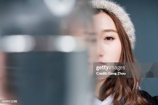 portrait of female through glass of water - distorted stock pictures, royalty-free photos & images
