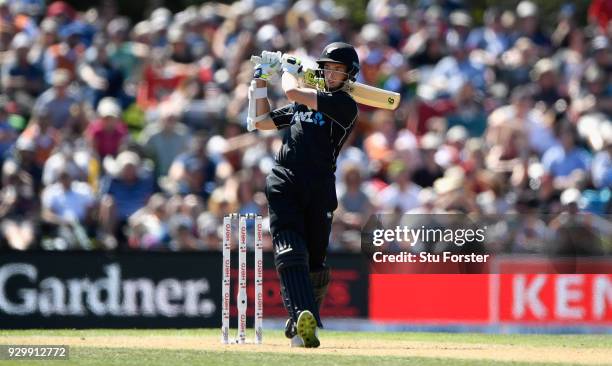 New Zealand batsman Mitchell Santner hits out during the 5th ODI between New Zealand and England at Hagley Oval on March 10, 2018 in Christchurch,...