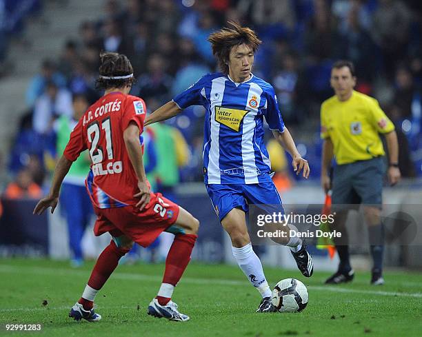 Shunsuke Nakamura of Espanyol is challenged by David Cortes of Getafe during the Copa del Rey, 2nd Leg match between Espanyol and Getafe at...