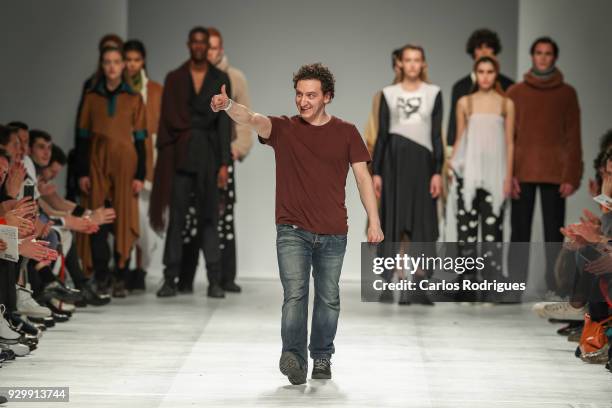 Designer Isidro Paiva walks the catwalk during his show for the Sangue Novo runway show at the 50th edition of Lisboa Fashion Week 'ModaLisboa' AW...