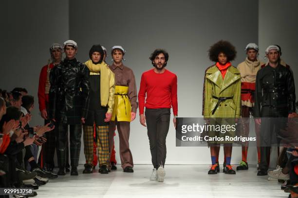 Designer Filipe Augusto walks the catwalk during his show for the Sangue Novo runway show at the 50th edition of Lisboa Fashion Week 'ModaLisboa' AW...