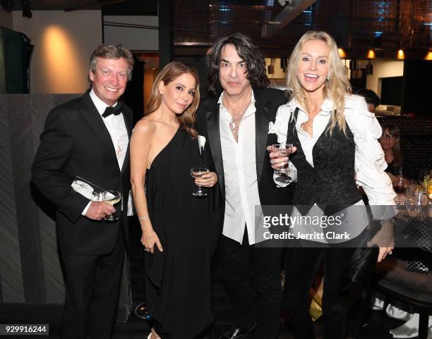 Nigel Lythgoe, guest Paul Stanley of KISS and Erin Sutton and guests attend "An Iconic Affair" hosted by Crustacean Beverly Hills in Celebration of...