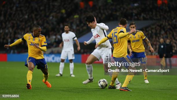 Tottenham Hotspur's Son Heung-Min takes on Andrea Barzagli of Juventus during the UEFA Champions League Round of 16 Second Leg match between...