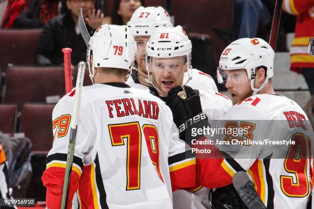 Sam Bennett of the Calgary Flames celebrates his first period goal against the Ottawa Senators with teammates Micheal Ferland, Brett Kulak and Dougie...