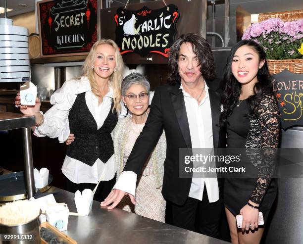 Erin Sutton and Paul Stanley of KISS pose with Chef Helene "Mama" An and Katiykyn Kew attend "An Iconic Affair" hosted by Crustacean Beverly Hills in...