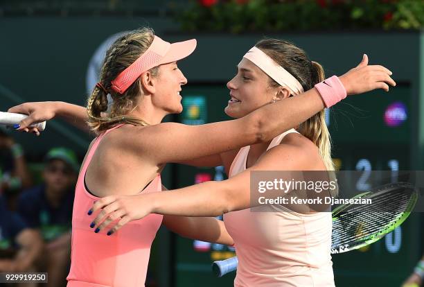 Belarus doubles partners Victoria Azarenka and Aryna Sabalenka celebrate after defeating Eugenie Bouchard of Canada and Sloane Stephens of United...