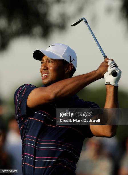Tiger Woods of the USA plays an approach shot to the 10th hole during round one of the 2009 Australian Masters at Kingston Heath Golf Club on...