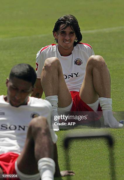 Costa Rican footballer Bryan Ruiz takes a rest after a training session in the province of Alajuela, some 20 km west from San Jose, on November 11,...