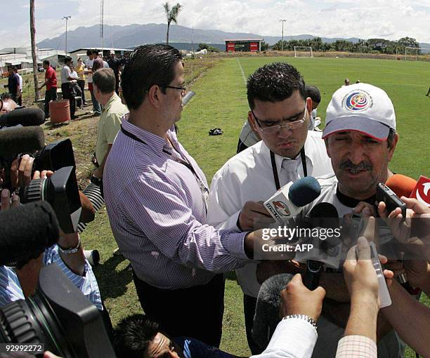 Costa Rican football team coach Brazilian Rene de Simoes talks to local and international media after a training session in the province of Alajuela,...