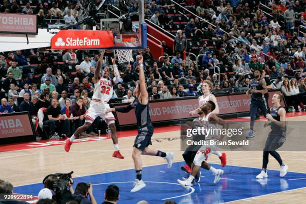 Kris Dunn of the Chicago Bulls shoots the ball during the game against the Detroit Pistons on MARCH 9, 2018 at Little Caesars Arena in Detroit,...