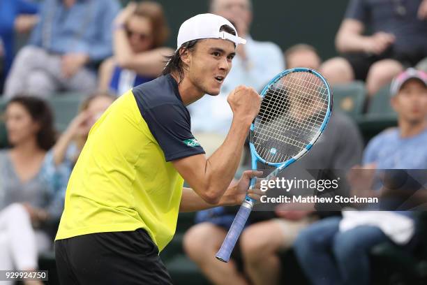 Taro Daniel of Japan celebrates a point against Cameron Noorie of Great Britain during the BNP Paribas Open at the Indian Wells Tennis Garden on...