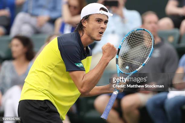 Taro Daniel of Japan celebrates a point against Cameron Noorie of Great Britain during the BNP Paribas Open at the Indian Wells Tennis Garden on...