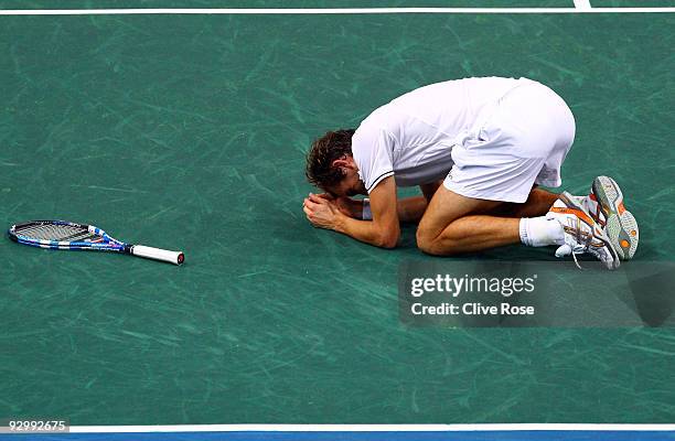 Julien Benneteau of France celebrates a win over Roger Federer of Switzerland during the ATP Masters Series at the Palais Omnisports De Paris-Bercy...